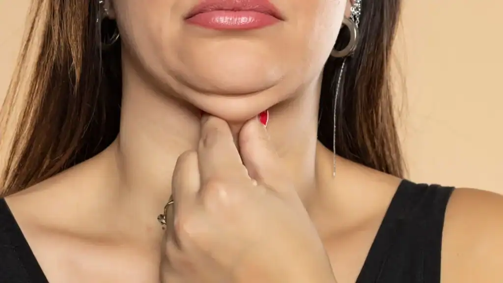 An image of a woman with double chin, sad, worried : Non Surgical Double Chin Removal Treatment in Gosport, UK